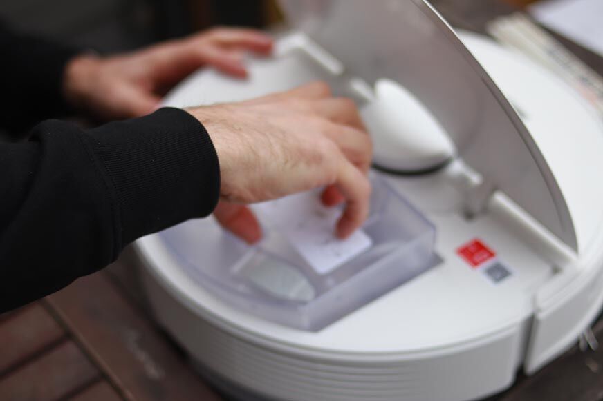 The water tank of the Roborock Q7 Max being removed.